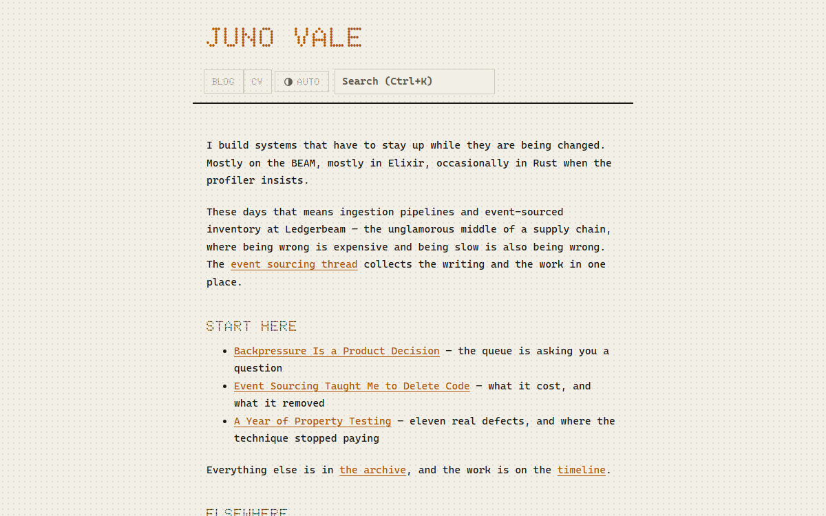 The flipdot theme blog index: amber dot-matrix titles on a black board with a status column